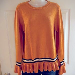 Adorable ruffled hem sweater.